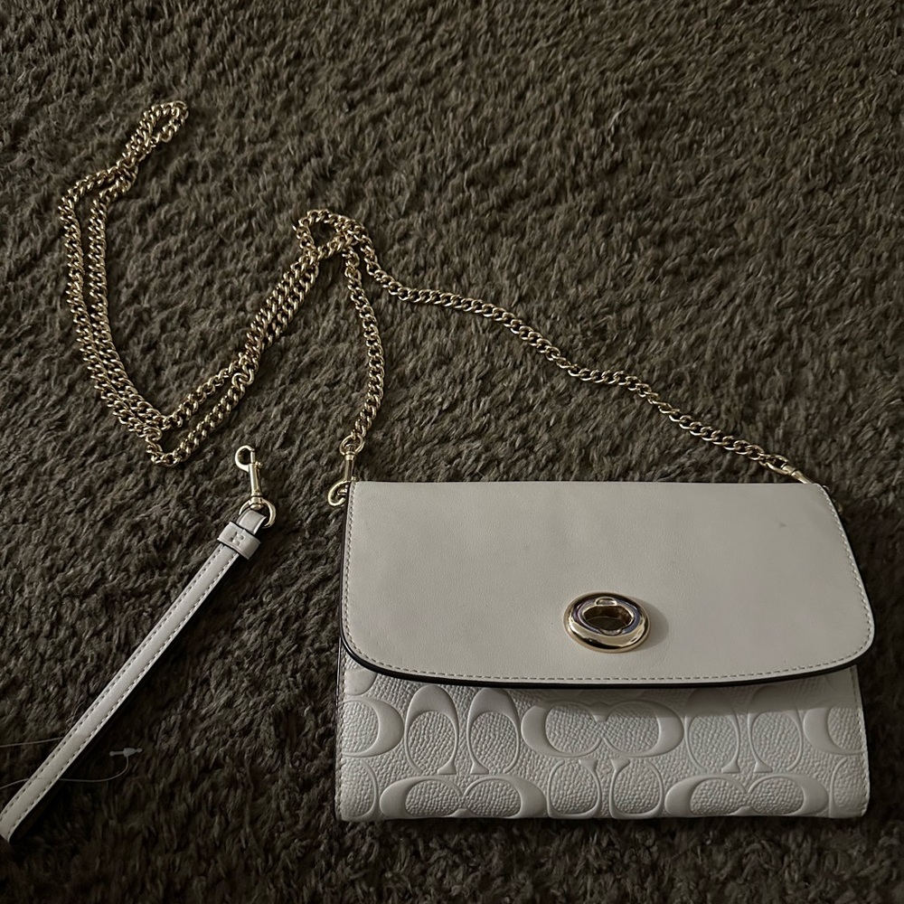 White purse with hand strap